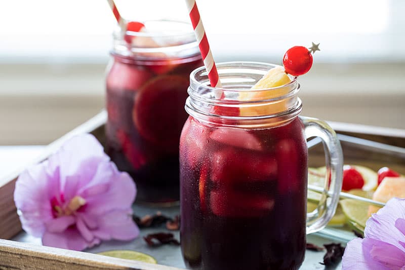 Pressure Cooker (Instant Pot) Zobo Drink - Hibiscus Tea in mason jars with straws