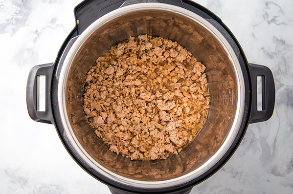 ground pork in the bottom of an Instant Pot