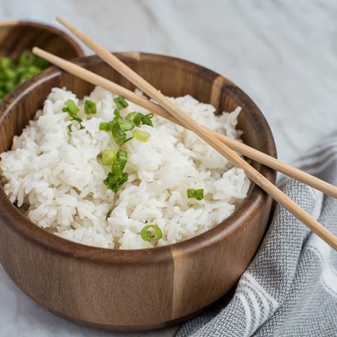 Instant Pot / Pressure Cooker White Rice prepared, garnished with green onions and chopsticks