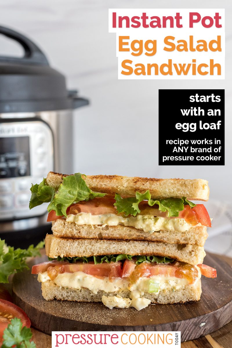 Pinterest Image that reads "Instant Pot Egg Salad Sandwiches: Starts with an Egg Loaf" with a straight-on picture of cut egg salad sandwiches with toasted bread, green leaf lettuce, tomatoes, and egg salad, layered with two halves on top of each other, with an Instant Pot in the background