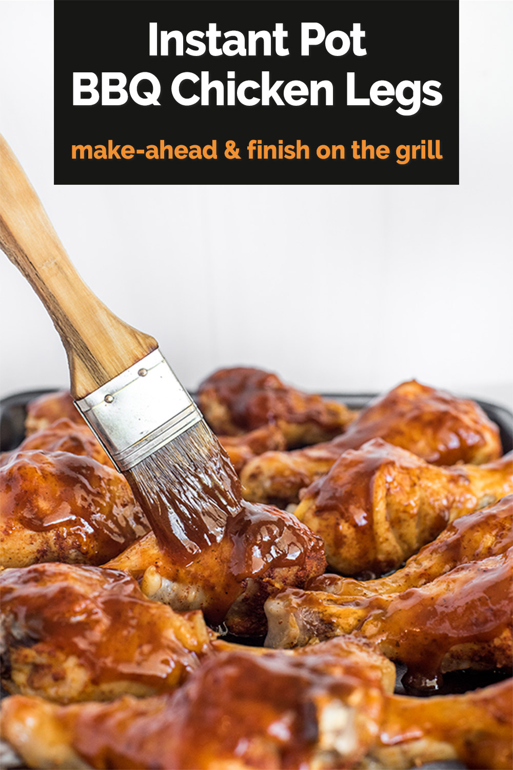 Pinterest image for Instant Pot BBQ Chicken Legs: make-ahead and finish on the grill" showing a small brush coating bone-in chicken legs with barbecue sauce via @PressureCook2da