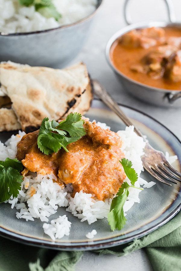 A close up of Pressure Cooker / Instant Pot Butter Chicken served on a bed of basmati rice