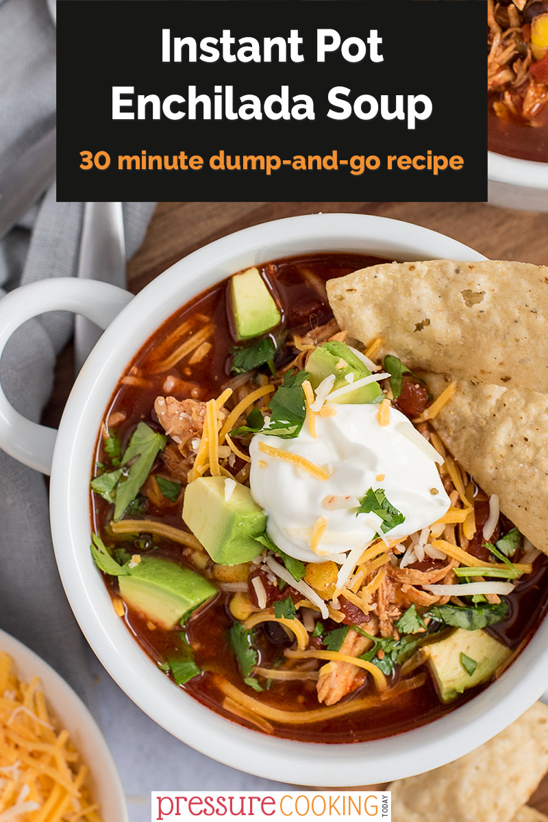 Pinterest image with a black text box that reads "Instant Pot Enchilada Soup: a 30-minute dump-and-go recipe", overlaid on a close-up overhead photo featuring chicken enchilada soup, with cilantro, avocados, shredded cheese, and tortilla chips via @PressureCook2da