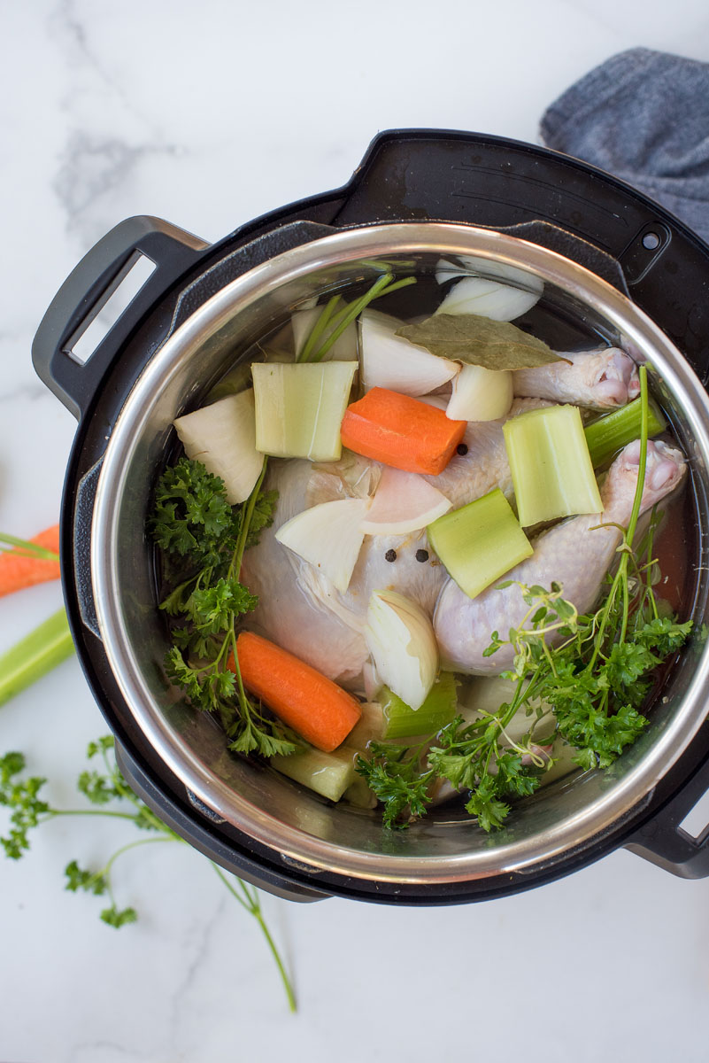 cooking chicken stock with carrots, celery and onions in an instant pot