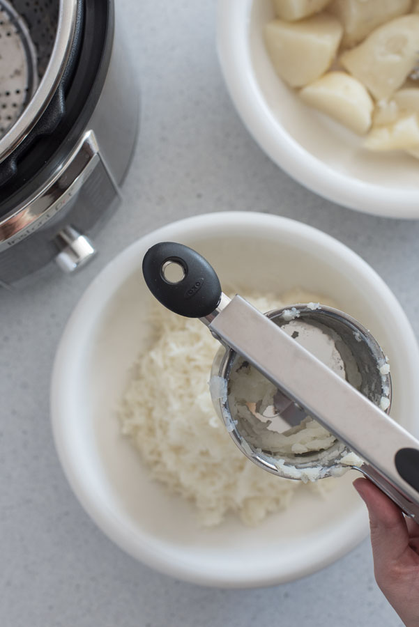 Using a potato ricer to make Mashed Potatoes in the pressure cooker
