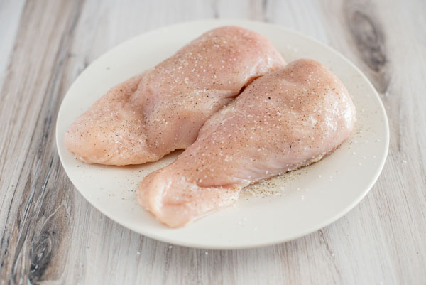 Raw Chicken Breasts ready to be cooked into Pressure Cooker Chicken and Rice with broccoli and cheese sauce