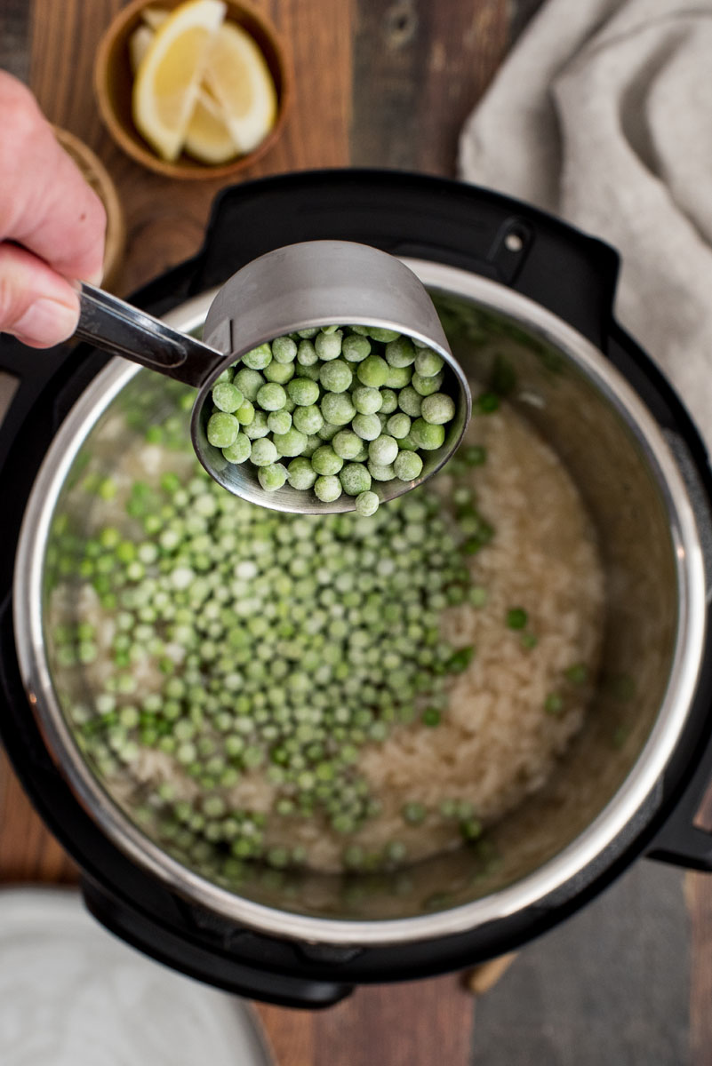 Adding frozen peas to lemon risotto cooked in an Instant Pot