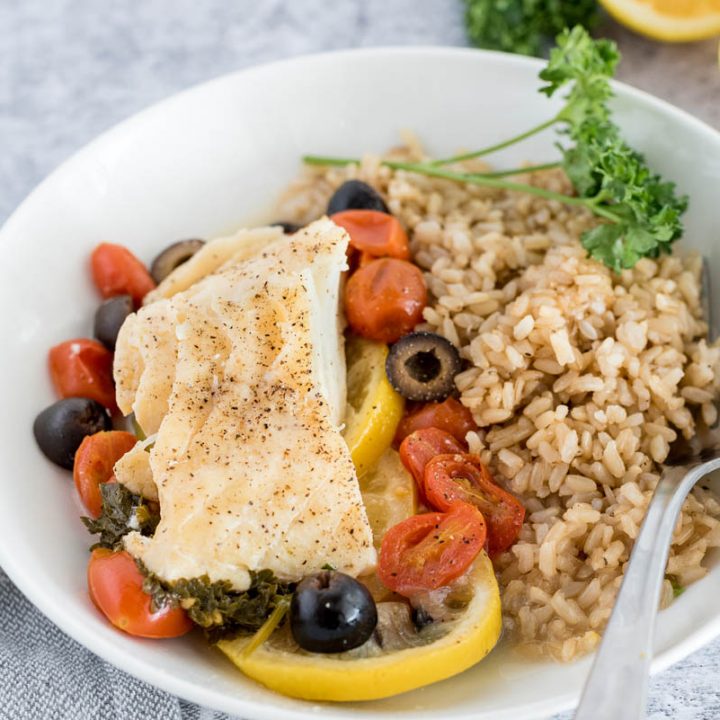 close up on a plate with mediterranean fish en papillote