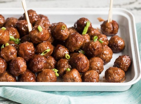 InstaPot grape jelly bbq meat balls on a platter and ready to serve for a party.