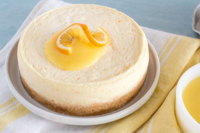 whole instant pot meyer lemon cheesecake with lemon curd on top