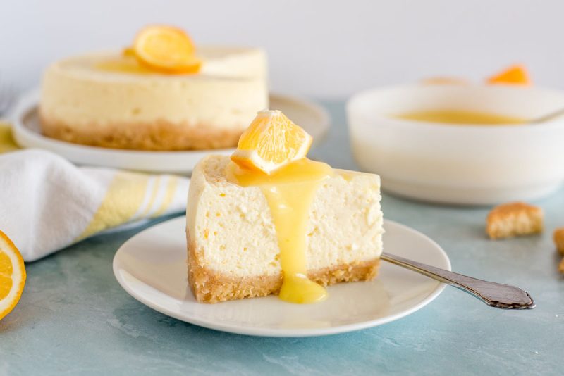 slice of lemon cheesecake with lemon curd