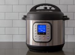 An Instant Pot Duo Nova on a gray counter displaying the burn notice on a blue digital screen
