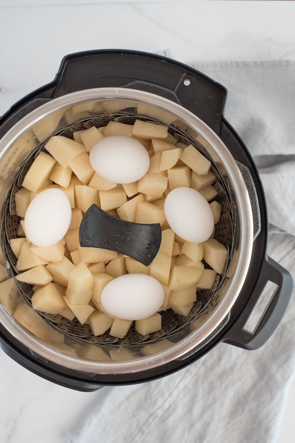 potatoes and whole eggs inside pressure cooker
