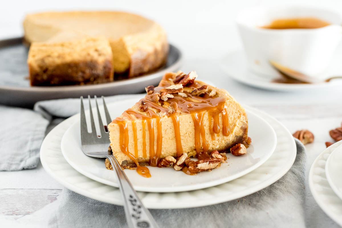 slice of instant pot cheesecake with homemade caramel sauce