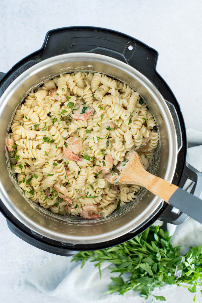 overhead of an instant pot with shrimp alfredo pasta
