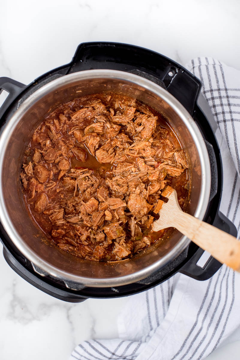 overhead of an instant pot with sweet pork cooking inside