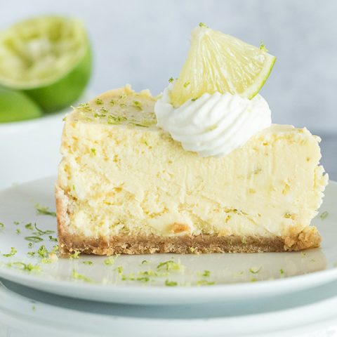 slice of instant pot key lime pie with cream and lime slices on top