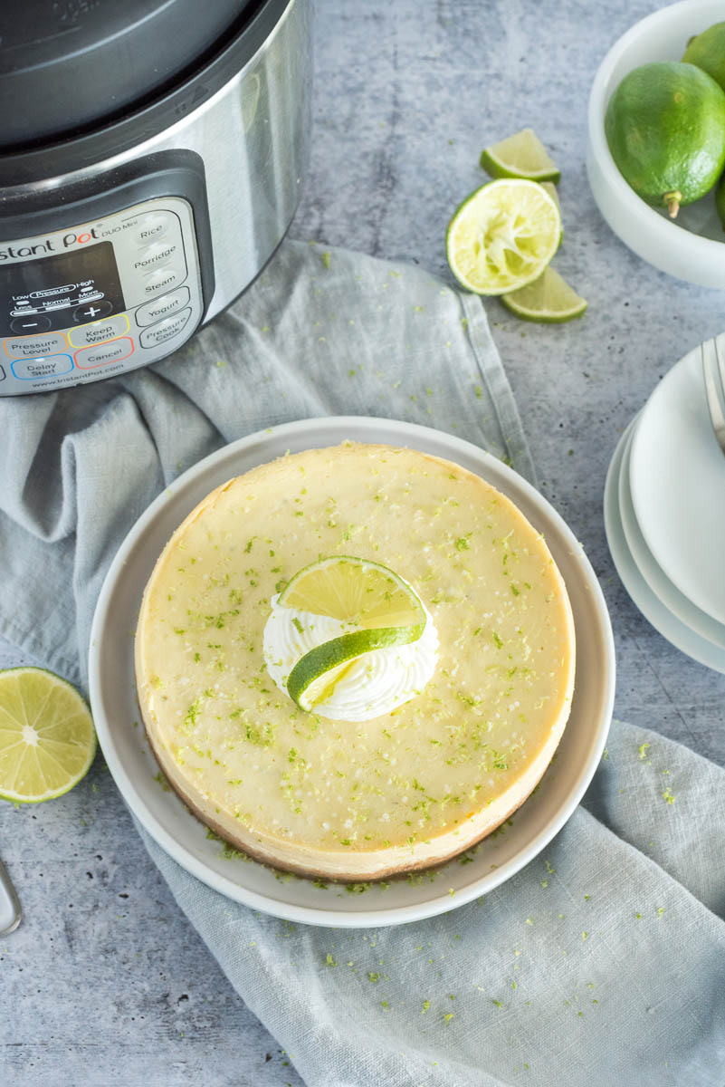 key lime pie in front of an instant pot pressure cooker