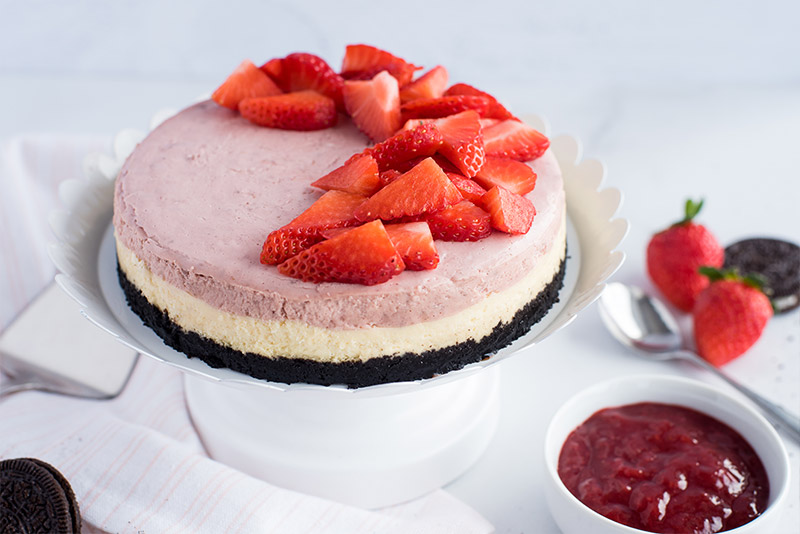 Strawberry Cheesecake with diced strawberries garnished on top.