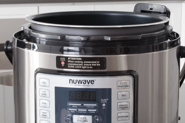 Nutri-Pot NuWave Pressure Cooker with the lid removed from the hinge.