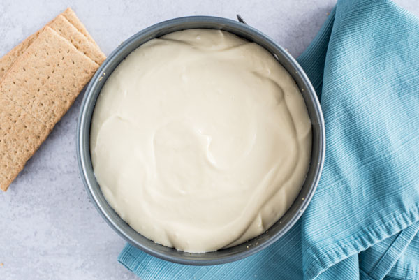 A cheesecake batter in a springform pan ready to be place in an Instant Pot.