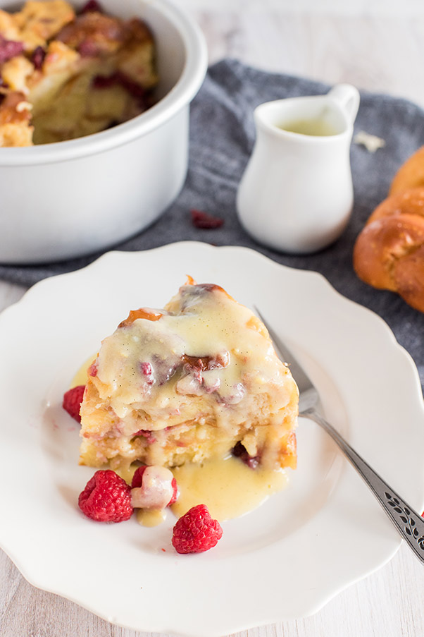 A close up of a plate with raspberry orange bread pudding