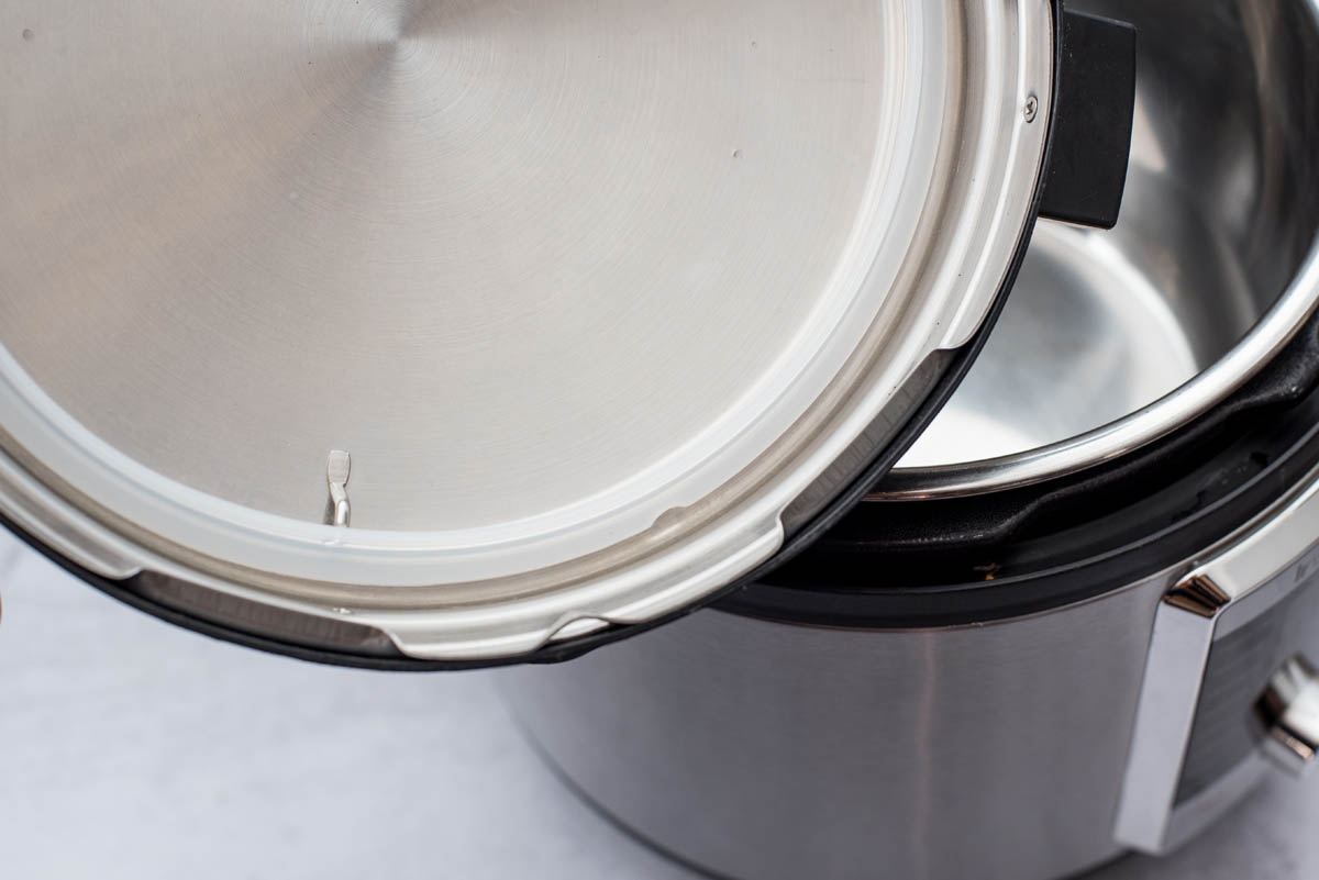 A close-up of the inside of the pressure cooking lid, featuring the silicone ring in place