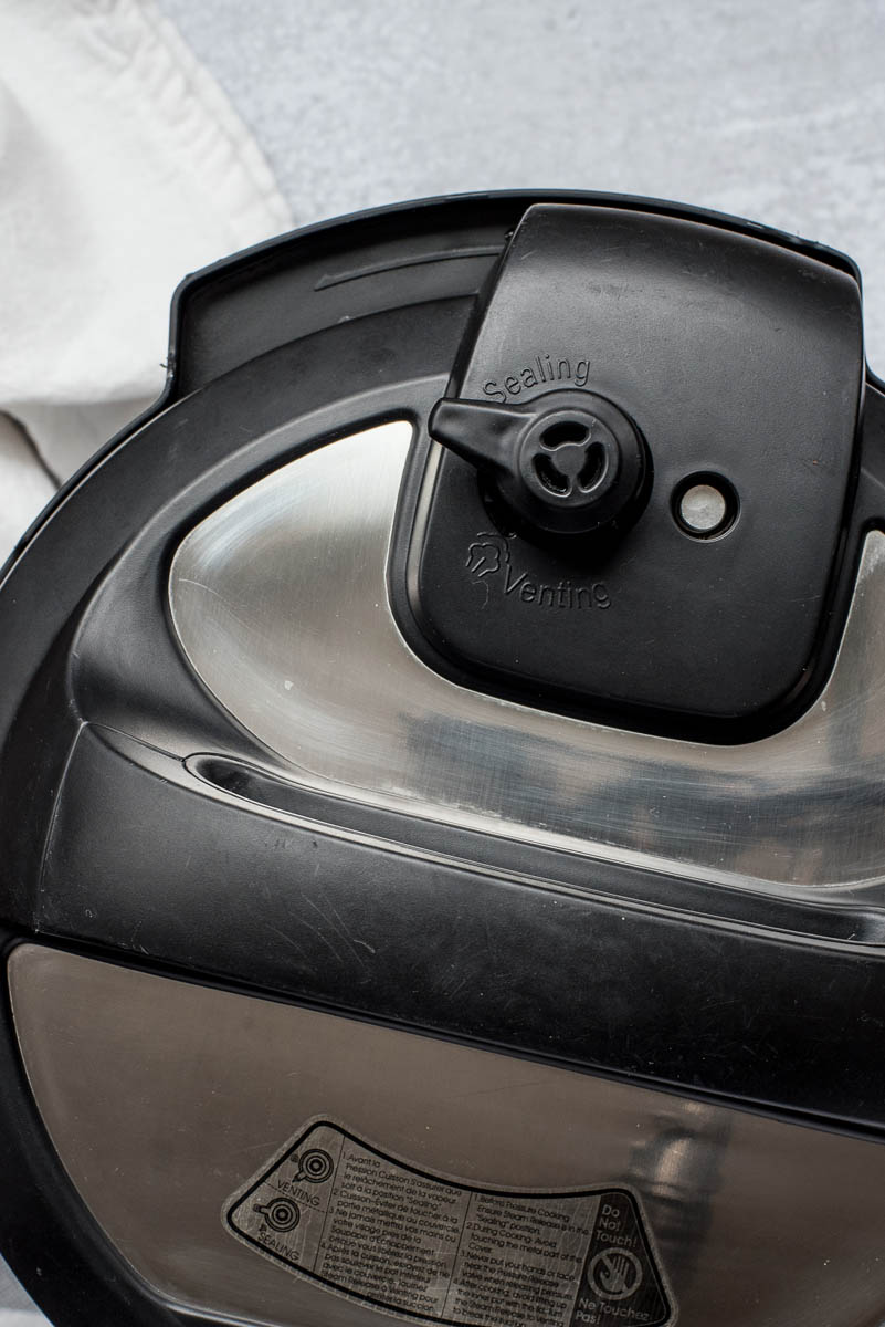 An overhead shot showing the sealing valve on an Instant Pot lid