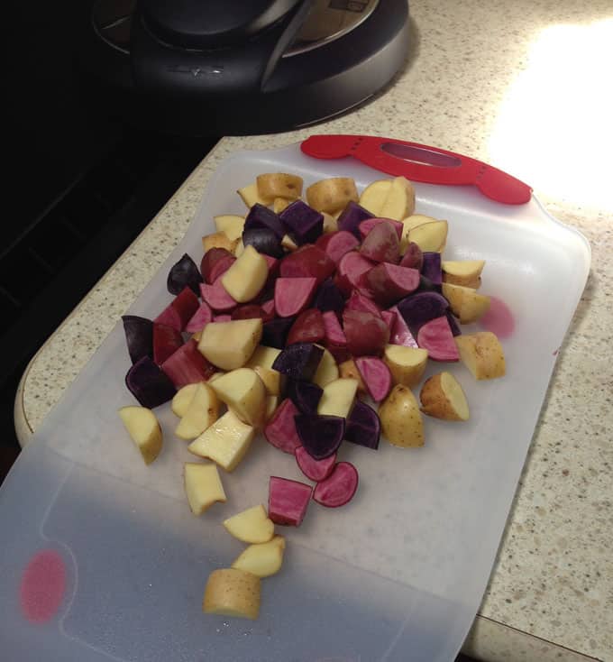 Red-White-Blue-Fingerling-Potatoes on a cutting board
