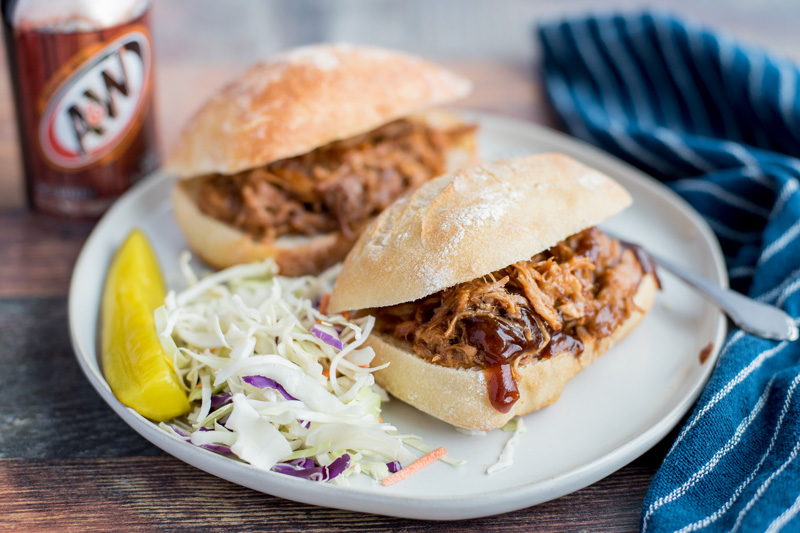 Instant Pot / Pressure Cooker Root Beer Pulled Pork sandwiches plated and ready to serve