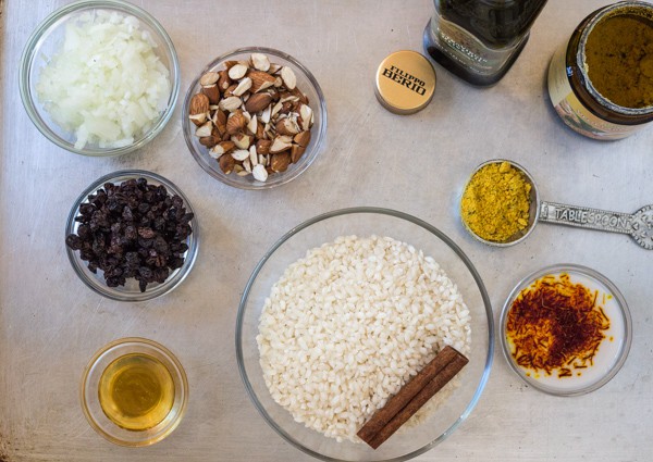prep bowls with ingredients for Pressure Cooker Saffron Risotto with Almonds and Currants 