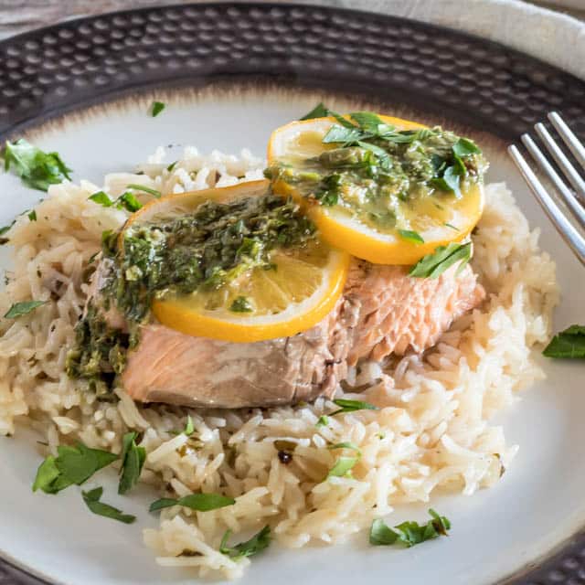 Pressure Cooker Salmon and Rice topped with capers and chimichurri sauce