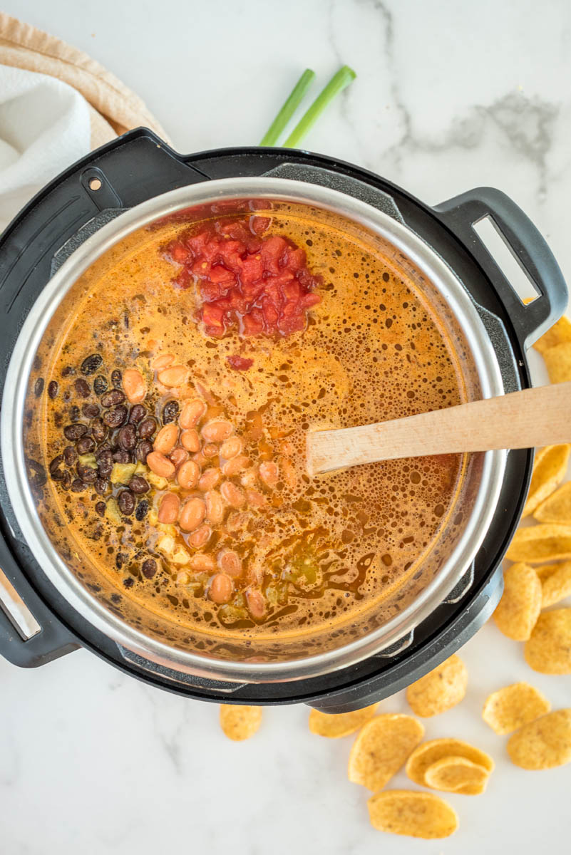 Overhead shot of Instant Pot taco soup with ingredients added and ready to cook.